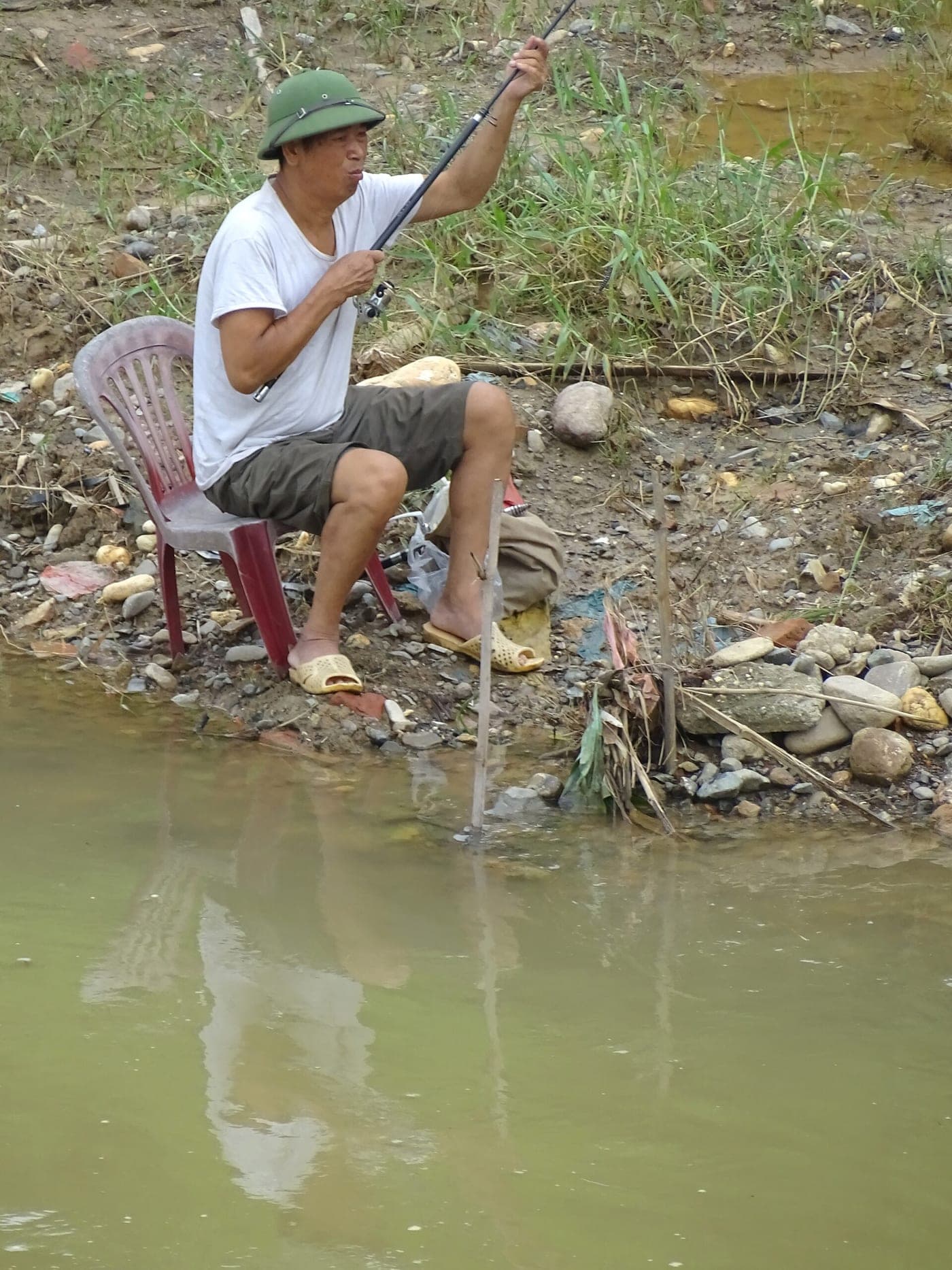 Fisherman at River's Edge - Cao Bang - Vietnam (48113281632)
